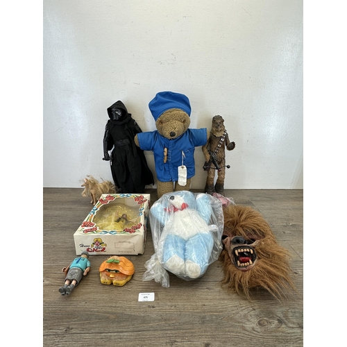 475 - A collection of toys to include Disney Store Ltd. 2014 Chewbacca figurine, TM Lucasfilm Ltd. Thinkwa... 