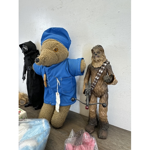 475 - A collection of toys to include Disney Store Ltd. 2014 Chewbacca figurine, TM Lucasfilm Ltd. Thinkwa... 