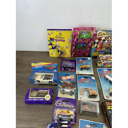 478 - A collection of boxed diecast model vehicles to include Smarties advertising van, Brooke Bond Bump &... 