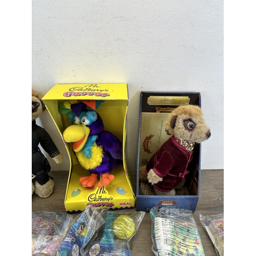 479 - A collection of toys to include two Yakov's Toy Shop Compare the Meerkat soft toys, McDonalds Happy ... 