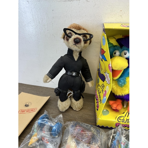 479 - A collection of toys to include two Yakov's Toy Shop Compare the Meerkat soft toys, McDonalds Happy ... 