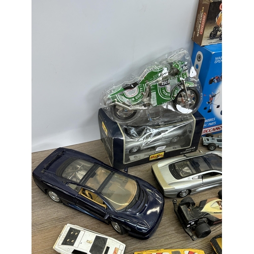 486 - A collection of diecast model vehicles to include Ertl 1848 Jaguar XK-120, boxed Maisto Jaguar XC220... 