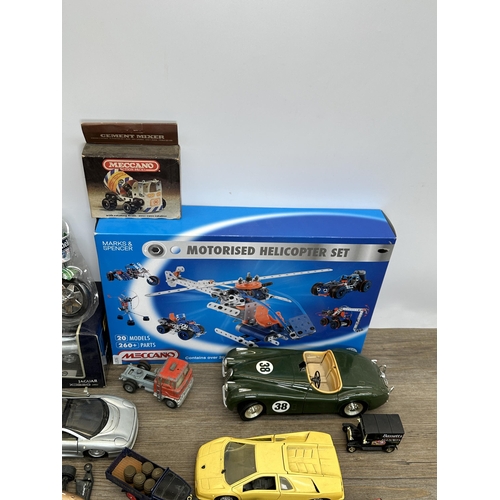 486 - A collection of diecast model vehicles to include Ertl 1848 Jaguar XK-120, boxed Maisto Jaguar XC220... 