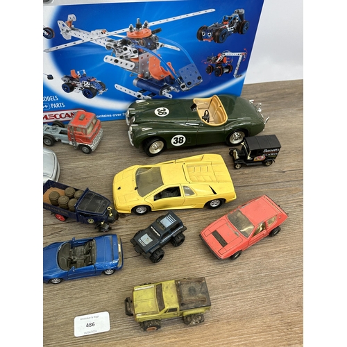 486 - A collection of diecast model vehicles to include Ertl 1848 Jaguar XK-120, boxed Maisto Jaguar XC220... 