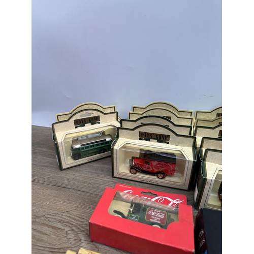 502 - A collection of boxed diecast model vehicles to include Bassett's Liquorice Allsorts delivery van, C... 