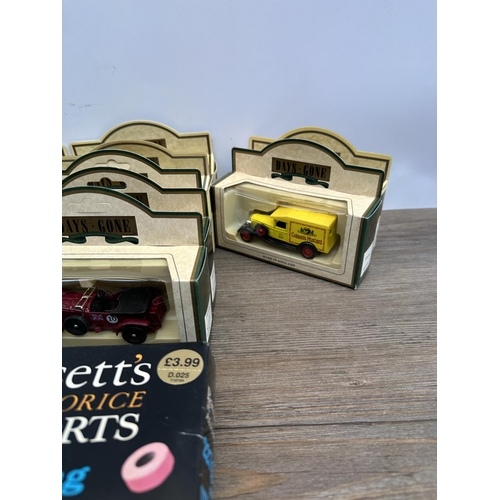 502 - A collection of boxed diecast model vehicles to include Bassett's Liquorice Allsorts delivery van, C... 