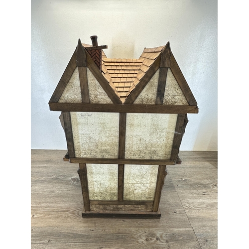 538 - A 2013 Roy Williams handmade Tudor style two storey doll's house - approx. 76cm high x 53cm wide x 3... 