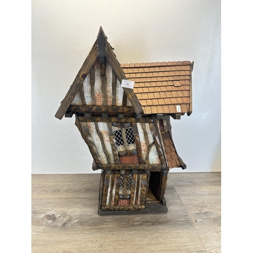 540 - A 2012 Roy Williams handmade Tudor style two storey doll's house - approx. 71cm high x 45cm wide x 3... 