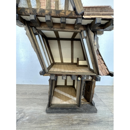 540 - A 2012 Roy Williams handmade Tudor style two storey doll's house - approx. 71cm high x 45cm wide x 3... 