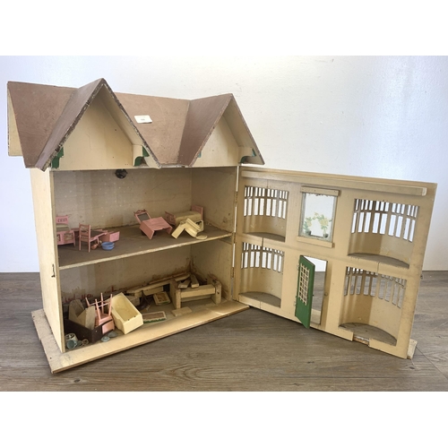 522 - A vintage handmade wooden and painted two storey doll's house - approx. 56cm high x 54cm wide x 31cm... 