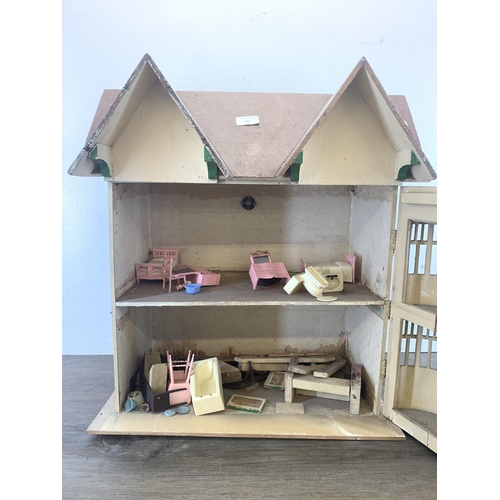 522 - A vintage handmade wooden and painted two storey doll's house - approx. 56cm high x 54cm wide x 31cm... 