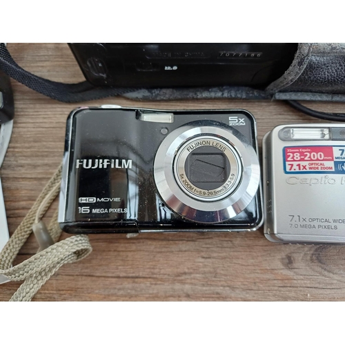 707 - A collection of cameras and accessories to include Fujifilm FinePix AX650 16mp compact digital camer... 