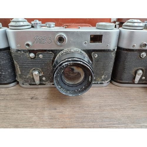 708 - Six Eastern European 35mm cameras, three cased FED screwmount rangefinder, FED 3b  fitted with Indus... 