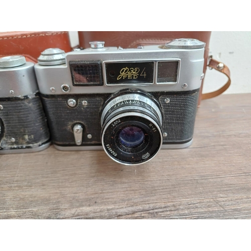 708 - Six Eastern European 35mm cameras, three cased FED screwmount rangefinder, FED 3b  fitted with Indus... 