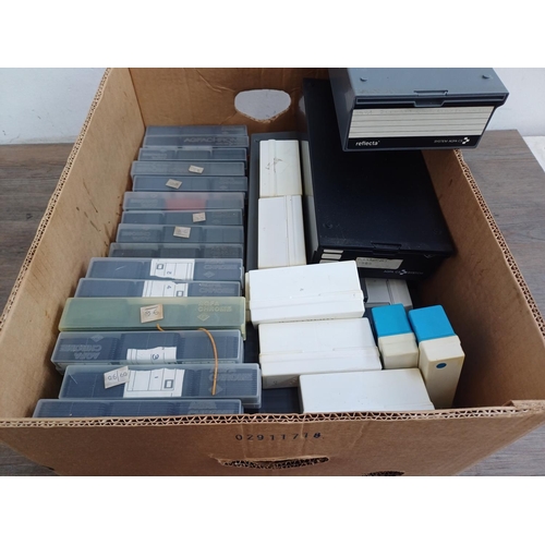 711 - Three boxes containing a large quantity of slides and a boxed Agfascop 200 slide viewer