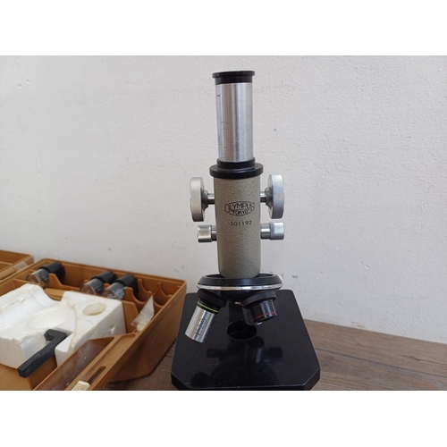 712 - A cased vintage Olympus student microscope with accessories to include Watson Para x100 2mm 1.30 O.I... 