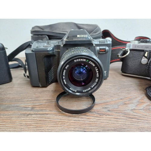 713 - Four 35mm SLR cameras, one Pentax ME Super fitted with Pentax-M 1:1.7 50mm lens, one Ricoh XR-X fitt... 