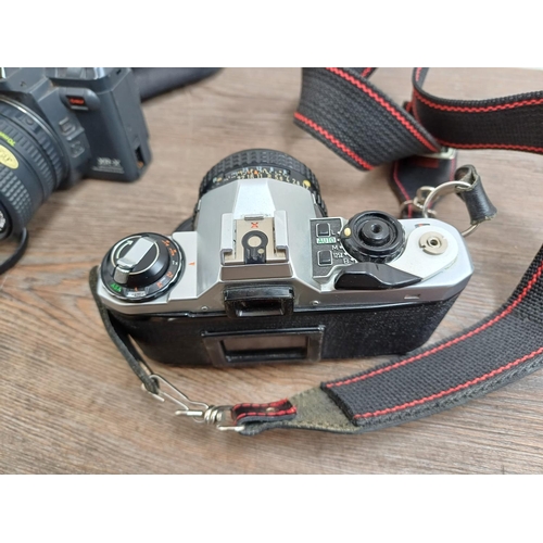 713 - Four 35mm SLR cameras, one Pentax ME Super fitted with Pentax-M 1:1.7 50mm lens, one Ricoh XR-X fitt... 