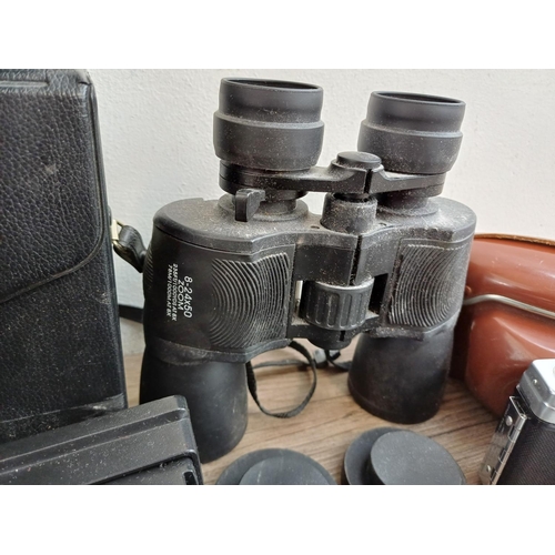 715 - A collection of vintage cameras, binoculars and accessories to include Kodak Baby Brownie, Prinz 10x... 