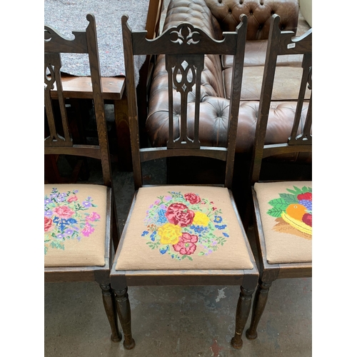 240 - Four Art & Crafts oak and tapestry upholstered dining chairs