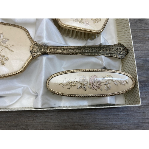 559 - A vintage boxed Regent of London petit point four piece dressing table set