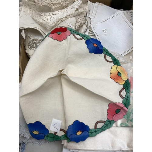 560 - Two boxes containing a collection of vintage embroidered and lace linen