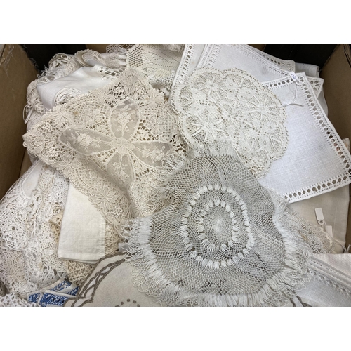 560 - Two boxes containing a collection of vintage embroidered and lace linen