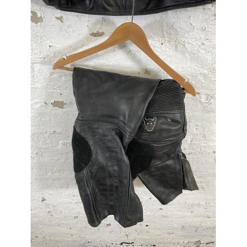 562 - A Buffalo black leather motorbike jacket and trouser set - size UK 44