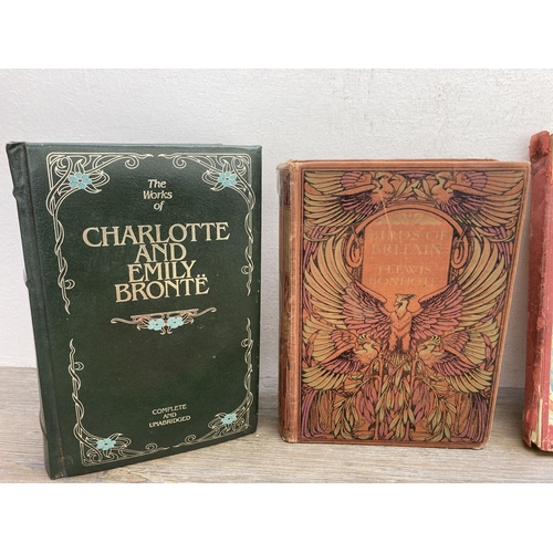 563 - Twelve antique and later hardback books to include The Works of Charlotte and Emily Bronte, Birds of... 