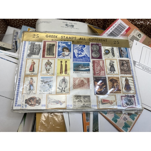 580 - A vintage brown leather suitcase containing a collection of first day covers, postcards and letters