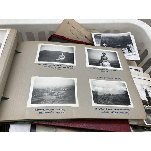 590 - A large collection of antique and later black and white photographs