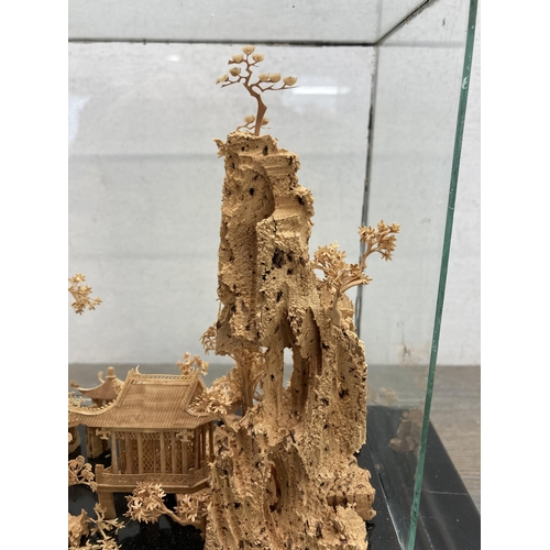 592 - An early to mid 20th century Chinese cork diorama in display case - approx. 24cm high x 29cm wide x ... 