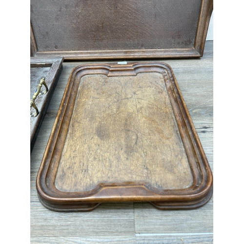 603 - Four antique and later carved wooden serving trays - largest approx. 43cm high x 66cm wide