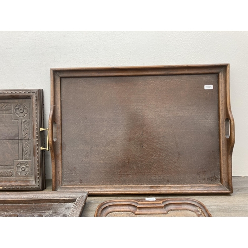 603 - Four antique and later carved wooden serving trays - largest approx. 43cm high x 66cm wide