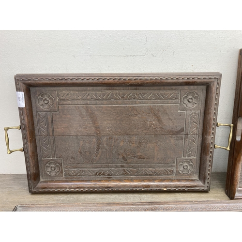 603 - Four antique and later carved wooden serving trays - largest approx. 43cm high x 66cm wide