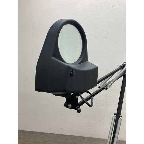 606 - A contemporary black metal angled magnifying desk lamp