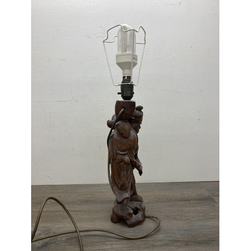 609 - A Chinese carved hardwood elder figural table lamp - approx. 55cm high (including bulb holder)