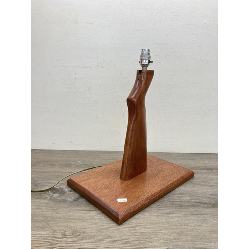 619 - A vintage carved teak rifle stock table lamp - approx. 42cm high