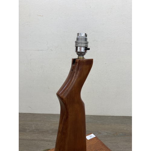 619 - A vintage carved teak rifle stock table lamp - approx. 42cm high