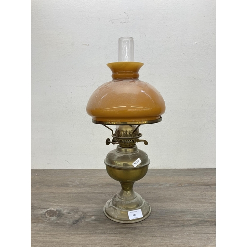 620 - A vintage Bamford brass oil lamp with amber glass shade