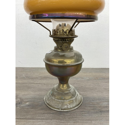 620 - A vintage Bamford brass oil lamp with amber glass shade