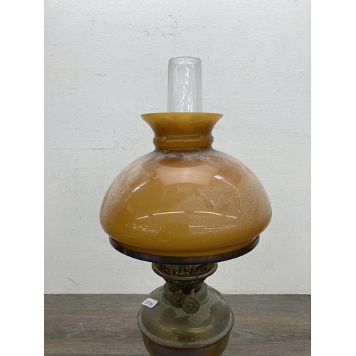 620 - A vintage Bamford brass oil lamp with amber glass shade