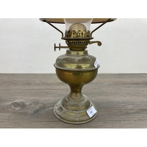 620 - A vintage Bamford brass oil lamp with amber glass shade