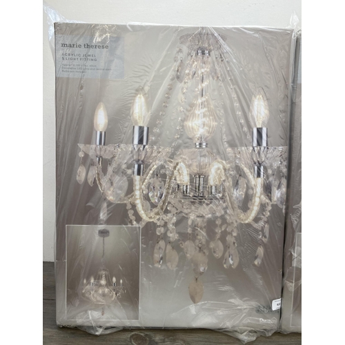 622 - Two boxed Dunelm Marie Therese acrylic jewel five branch chandeliers