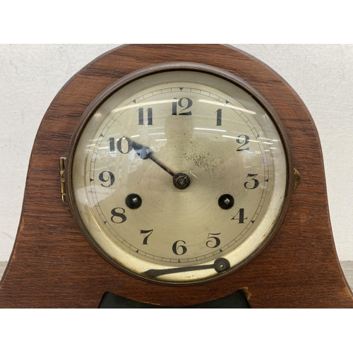 628 - A 1940s oak cased Napoleon Hat chiming mantel clock