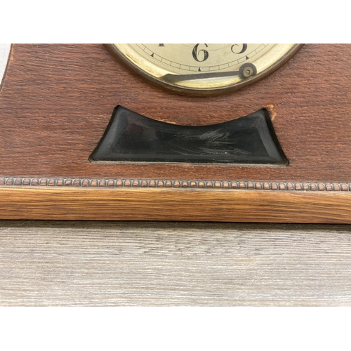 628 - A 1940s oak cased Napoleon Hat chiming mantel clock