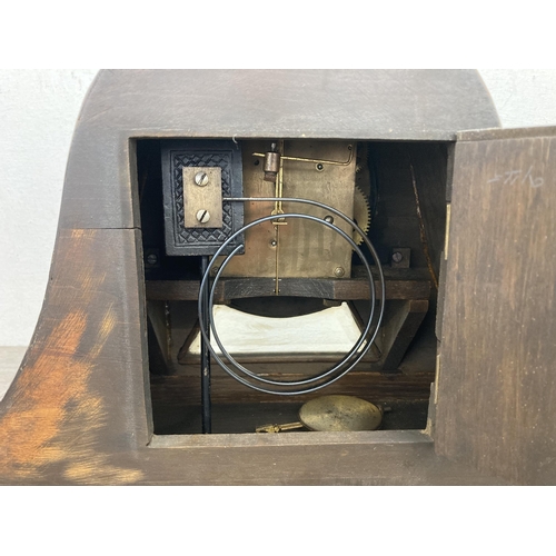 628 - A 1940s oak cased Napoleon Hat chiming mantel clock