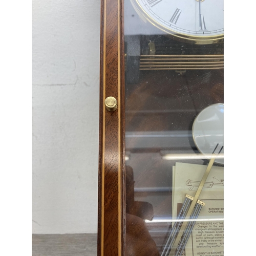 629 - A Comitti of London inlaid mahogany cased Westminster chime wall clock - approx. 70cm high x 22cm wi... 