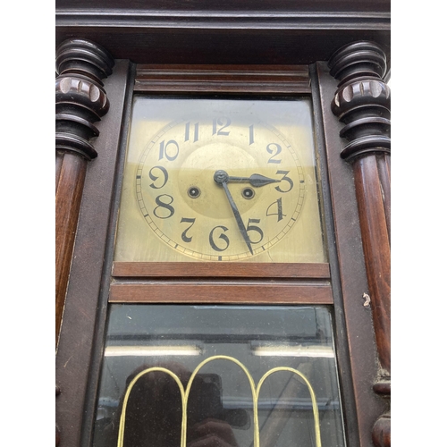 630 - A Victorian mahogany cased chiming wall clock