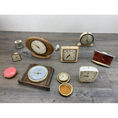 631 - A collection of mid 20th century clocks and barometers to include oak cased Shortland Smiths oak cas... 